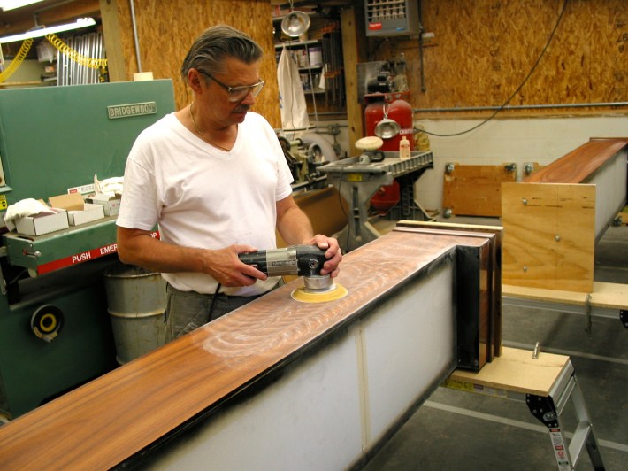 Ken Fritz, sanding a speaker.