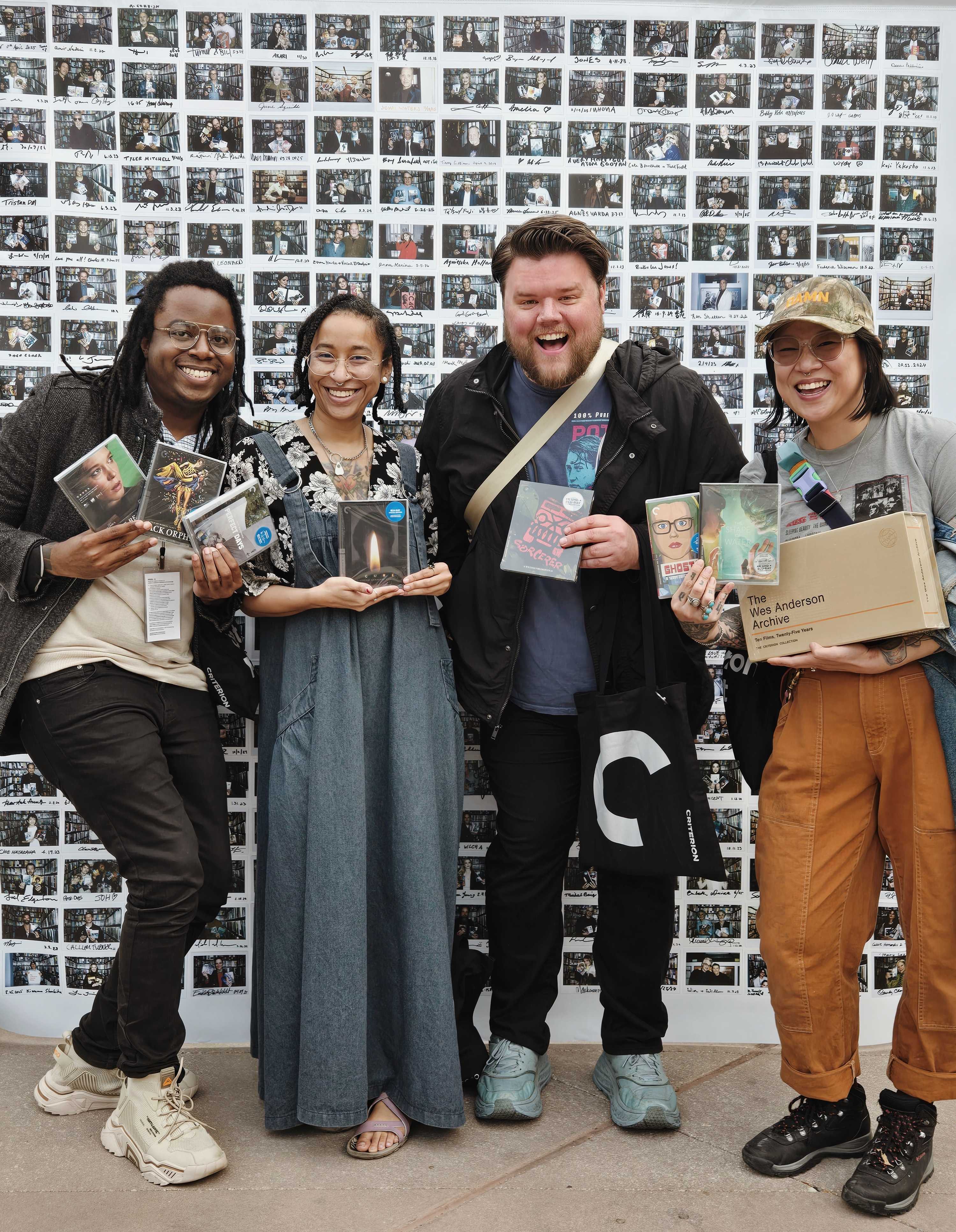 Dan, Kato, Rie, and I posing with our film picks next to a polariod mural of other celebrities who visited the Criterion Closet. 