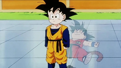 Dragon Ball Z still of Goten standing over a slumped afterimage of Kid Goku. 