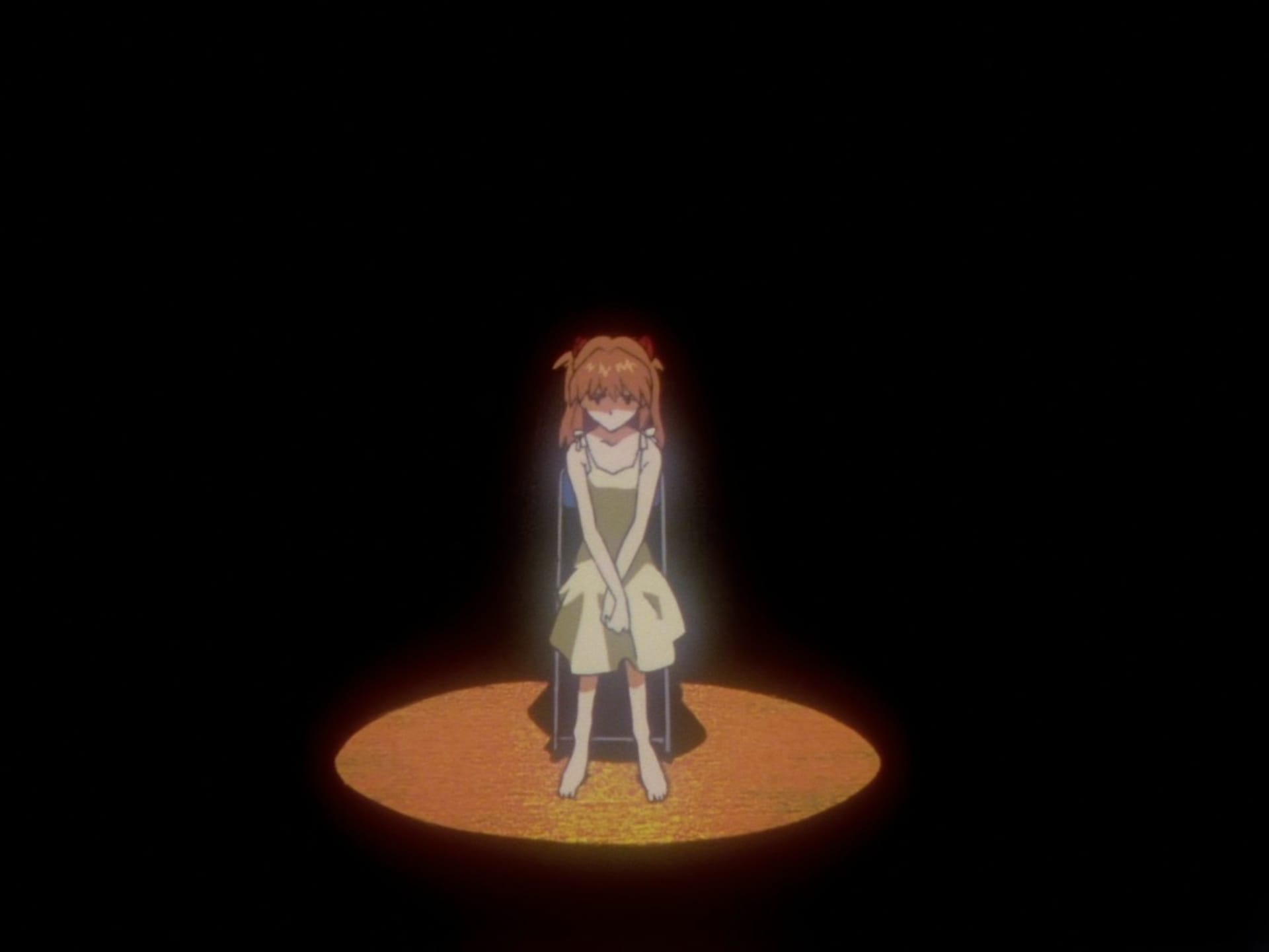 Asuka sitting under a spotlight.